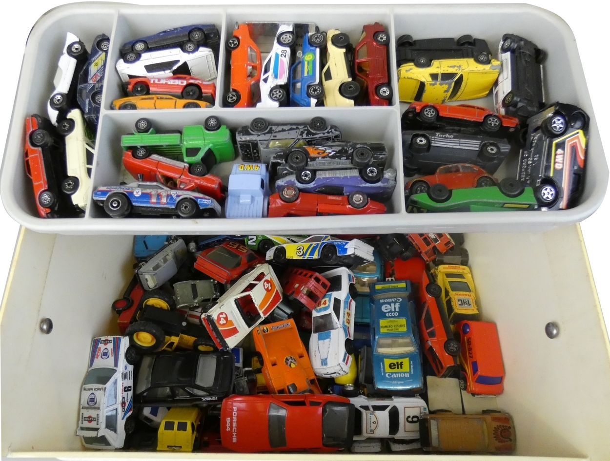 A collection of playworn die-cast vehicles housed in a carry display case, to include Matchbox,