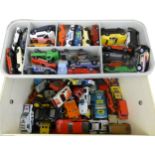 A collection of playworn die-cast vehicles housed in a carry display case, to include Matchbox,