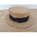 A quantity of hats including a straw boater, a leather satchel, leather wallets, a quantity of