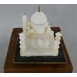 Of Taj Mahal interest, a 20 th century Indian carved and painted alabaster model of the building, (