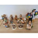 A collection of 13 Hummel figurines, together with Royal Doulton Balloon Lady, HN2935 and Balloon