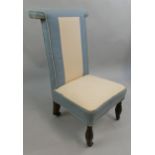 A Victorian Prie Dieu upholstered chair, upholstered in pale blue fabric.