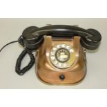 A Belgium copper body telephone, with brass carry handle and dial, converted.