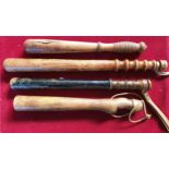 Four Victorian and later wooden truncheons, the longest 44 cm (4).