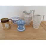 A Doulton earthenware mug, a Victorian relief moulded jug a Wedgwood Jasperware tea caddy,