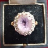 A 9ct gold amethyst and diamond cluster ring, 5.3 gm.