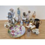 A Nao clown and boy group, a Lladro mother and daughter group, a Nao child and other ceramics.
