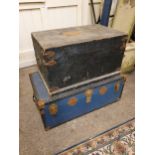 A black painted pine trunk with metal fittings, 74 x 46 cm and a blue school trunk (2).