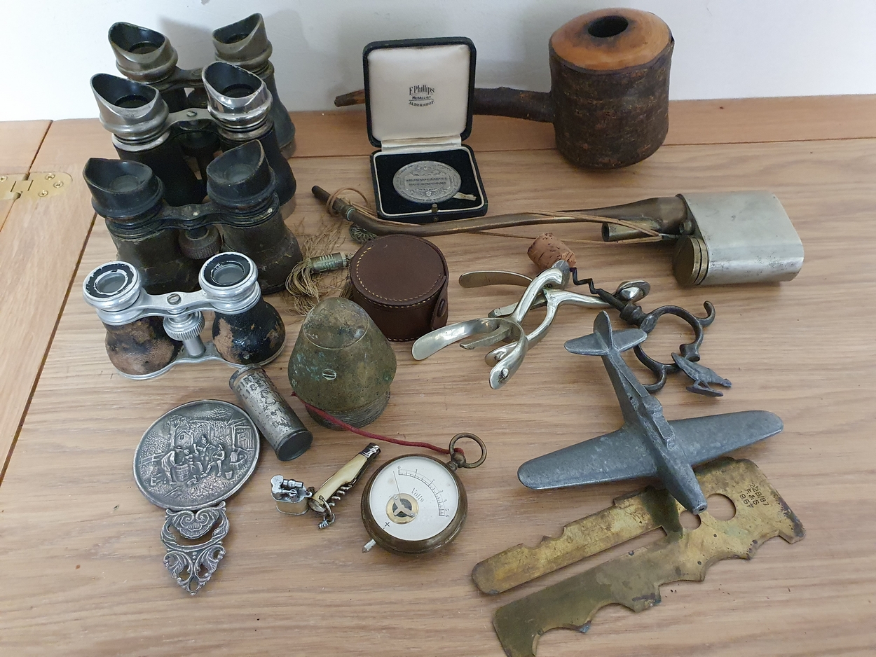 Four pairs of opera glasses, a pair of spurs and other collectibles.