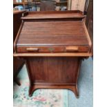 An Edwardian oak Lebus Desk, retailed by Taylor & Hobson Ltd of Huddersfield, the tambour top