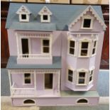 A scratch built large dolls house, the double opening front and lifting roof, storage drawer