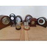 Two Smiths mantle clocks, two other mantle clocks, four smaller clocks and two barometers (10).