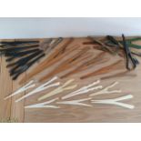 A collection of 24 glove stretchers, 5 ivory, 5 ebony, 5 boxwood and 3 boot hooks (27).