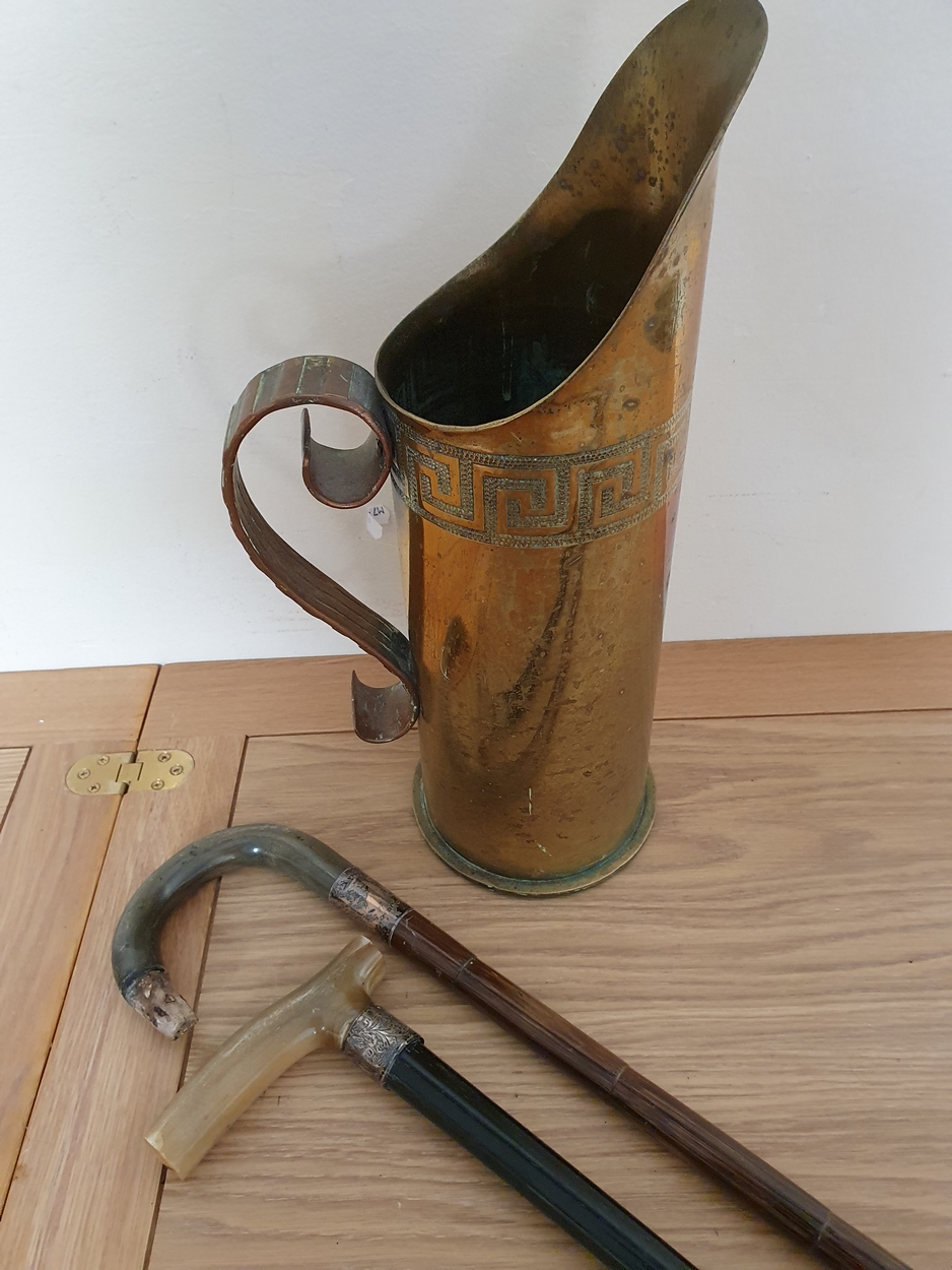 Trench Art; a brass shell dated 1909 formed as a jug with copper handle and two silver mounted