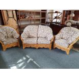 A cane three piece conservatory suite, two seater sofa and two armchairs (3).