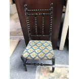 An Edwardian stained beech bobbin turned child's chair, with tapestry seat, 70 cm high.