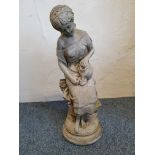 A concrete garden statue, depicting a lady pouring water from a jug, height 63 cm.