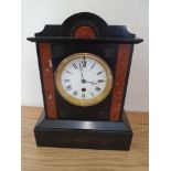 A French black and red slate mantle timepiece, cracked glass, key, no pendulum, 30 cm.