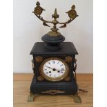 A French black slate mantle clock with brass mounts, key, no glass, pendulum or bell, 42 cm.