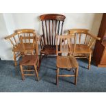 A pair of captains pine armchairs, a beech and elm Windsor style armchair and two small chairs (5)