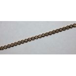 A 9ct gold diamond set line bracelet, weight 7.8g