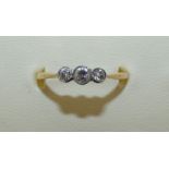 An 18ct gold three stone diamond ring collect set with old cut brilliants, approx 0.40 cts, weight