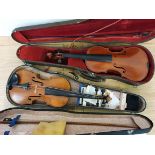 A violin with carved motif to peg box, bow, case and another violin, with Stradivarius label dated