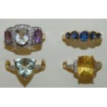 Four 9ct gold gem set rings, weight 11g