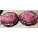 A pair of Victorian circular footstools with upholstered covers and metal studs 28cm diameter (2)