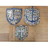 A set of three Faith, Hope and Charity mosaic wall shields made from pottery fragments, largest 41