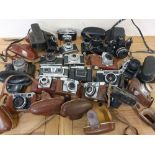 A collection of cameras, to include a Zeiss Super Ikonta camera, a Wray stereographic camera and a