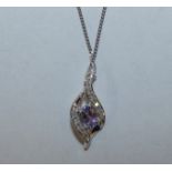 A 9ct white gold diamond set pendant, chain