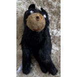 A vintage articulated teddy bear, 15cm tall