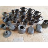 A collection of 19th century and later pewter ware, to include baluster mugs and jugs.