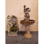 A resin bird bath, non functioning fountain, with statue to the centre, height 105 cm and another