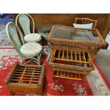 A collection of cane conservatory furniture, to include a green painted, glass topped table and