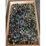 A substantial quantity of glass marbles (tray 84 x 53cm)