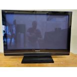 A Panasonic TH-42 PX80B 42" television, handset.