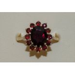 A 9ct gold garnet cluster ring size O 1/2, 3.5g