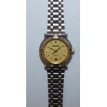 Gucci: a ladies gilt metal and stainless steel date wristwatch, model 9000L, cased