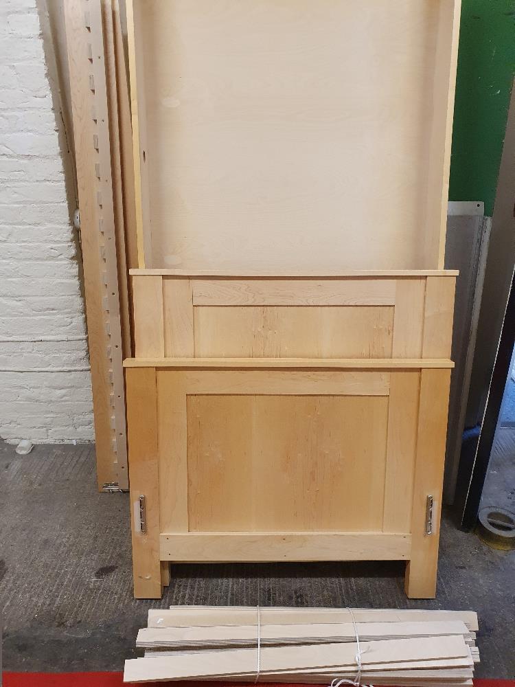 An ash single bed with trundle storage tray beneath, handmade by Furniture Workshop of Cranswick.