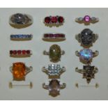 A collection of 13 gem set silver rings