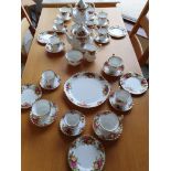 A Royal Albert Country Roses tea and coffee service for six place settings, comprising tea pot,