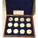 A limited edition proof gold plated 32g "History of Aviation" collection of 12, cased