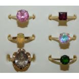 Six 9ct gold gem set single stone rings, gross weight 12g