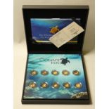 A limited edition proof gold "Oceans 10" coin set, 10 x 0.5g, booklet, certificate, case