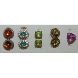 A pair of 9ct gold peridot ear studs, another pair of 9ct gold studs and two and a half silver ear
