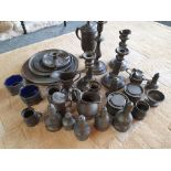 A collection of 19th century and later pewter, to include plates, jugs and candlesticks.