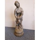 A concrete statue of a lady with a dove, height 83 cm.