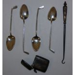 A set of four silver golf club teaspoons, Sheffield 1923, a silver vesta case and button hook